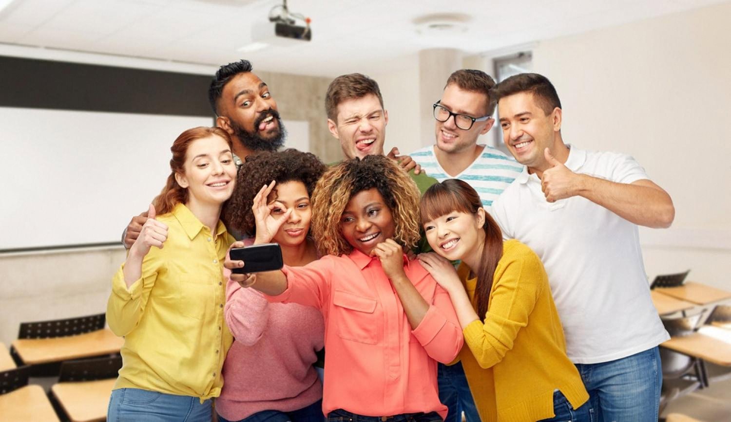 International CBSE students taking a selfie together in a classroom, showing cultural diversity